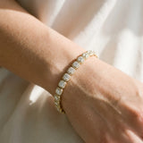 10K Yellow Gold 6.29 Carat F-G VS-SI Cushion Halo Diamond Tennis Bracelet with Channel Band and Bezel Setting
