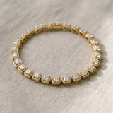 10K Yellow Gold 6.29 Carat F-G VS-SI Cushion Halo Diamond Tennis Bracelet with Channel Band and Bezel Setting
