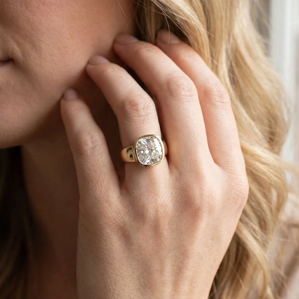 Yellow gold Cushion Solitaire Bezel Set Diamond Ring with Wide Band