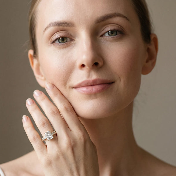 Yellow gold Emerald Brilliant Solitaire with Side Stones on a Pave Band and Four-Prong Setting