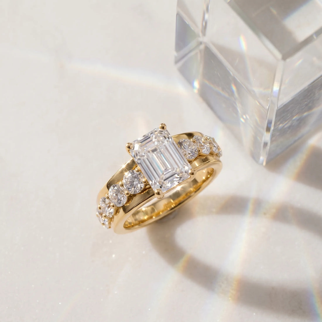 Yellow gold Emerald Brilliant Solitaire with Side Stones on a Pave Band and Four-Prong Setting_65