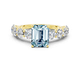 Yellow gold Emerald Cut Aquamarine Prong Setting with Side Stones on a Pave Band