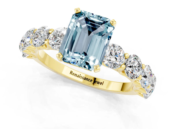 Yellow gold Emerald Cut Aquamarine Prong Setting with Side Stones on a Pave Band