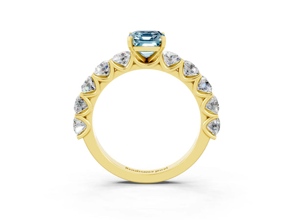 Yellow gold Emerald Cut Aquamarine Prong Setting with Side Stones on a Pave Band