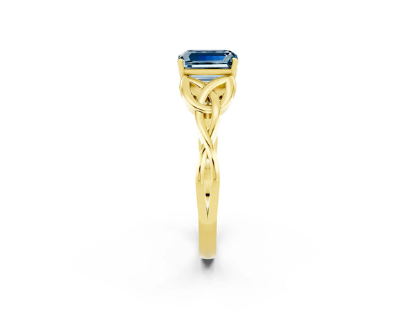 Yellow gold Emerald Cut Aquamarine Solitaire Celtic Knot Ring with Four-Prong Setting
