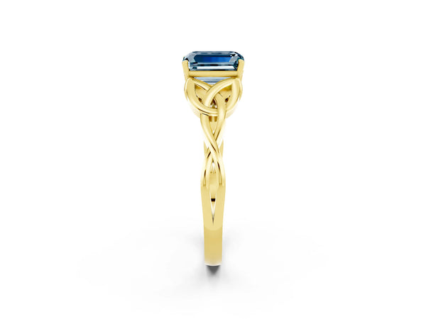 Yellow gold Emerald Cut Aquamarine Solitaire Engagement Ring with Celtic Knot Band and Four-Prong Setting