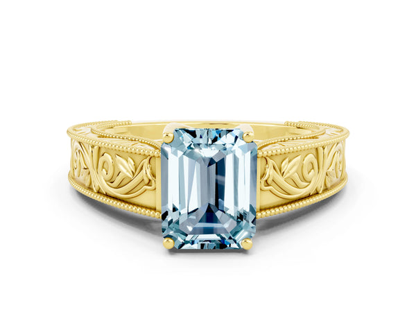 Yellow gold Emerald Cut Aquamarine Solitaire Ring with Engraved Band and Four-Prong Setting