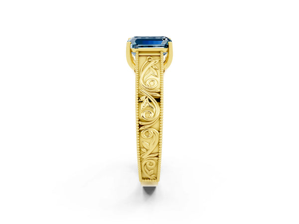 Yellow gold Emerald Cut Aquamarine Solitaire Ring with Engraved Band and Four-Prong Setting
