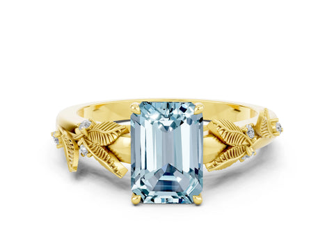 Yellow gold Emerald Cut Aquamarine Solitaire Ring with Leaf Motif Band and Four-Prong Setting