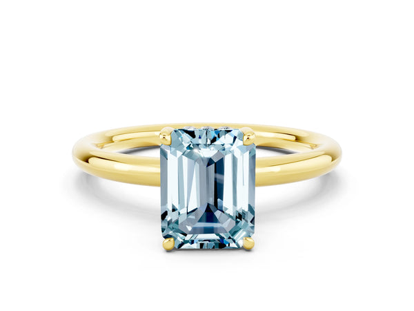 Yellow gold Emerald Cut Aquamarine Solitaire Ring with Thin Band and Four-Prong Setting