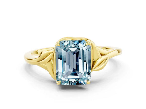 Yellow gold Emerald Cut Aquamarine Solitaire Ring with Twist Band and Four-Prong Setting
