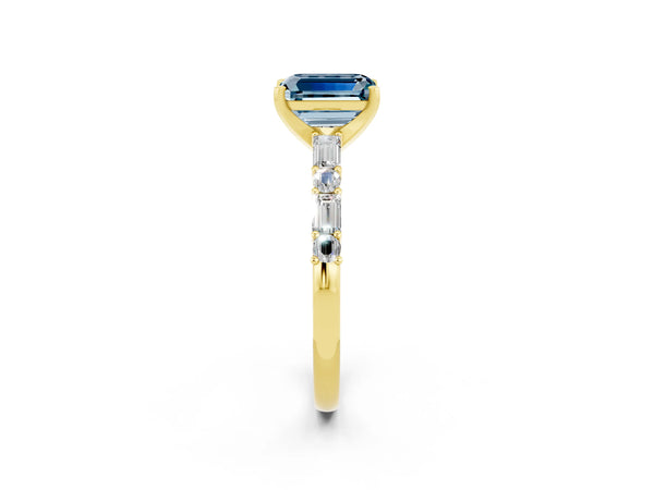 Yellow gold Emerald Cut Aquamarine Solitaire with Side Baguettes and Channel Set Band