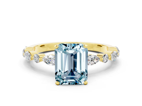 Yellow gold Emerald Cut Aquamarine Solitaire with Side Stones on a Pavé Band and Four-Prong Setting