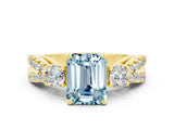 Yellow gold Emerald Cut Aquamarine Three-Stone Ring with Pavé Split Shank and Four-Prong Setting