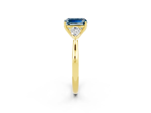 Yellow gold Emerald Cut Aquamarine Three-Stone Ring with Pear  Side Stones and Prong Setting