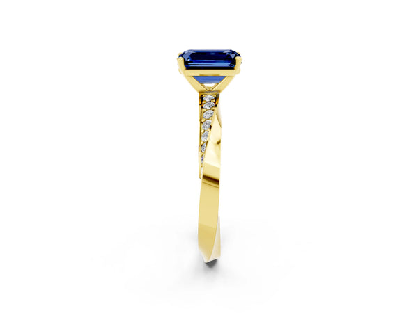 Yellow gold Emerald Cut Blue Sapphire Engagement Ring with Side Stone Accents and Four-Prong Setting
