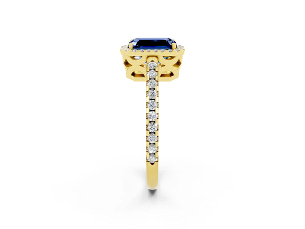 Yellow gold Emerald Cut Blue Sapphire Halo Engagement Ring with Pavé Band and Prong Setting