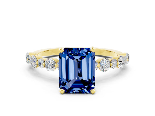 Yellow gold Emerald Cut Blue Sapphire Prong Set Engagement Ring with Pavé Band