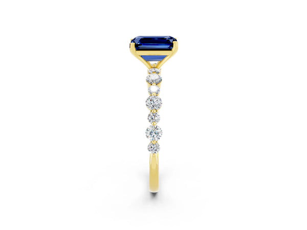 Yellow gold Emerald Cut Blue Sapphire Prong Set Engagement Ring with Pavé Band