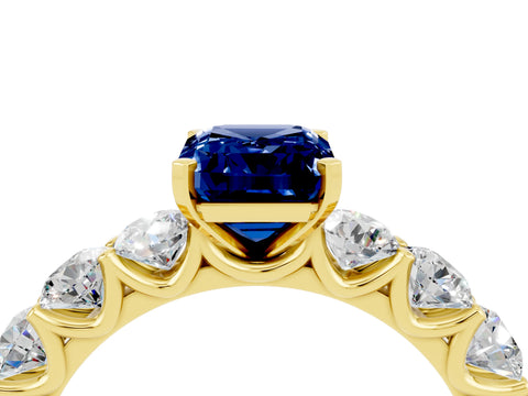 Yellow gold Emerald Cut Blue Sapphire Prong Setting with Side Stones on a Pave Band_4
