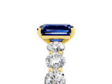 Yellow gold Emerald Cut Blue Sapphire Prong Setting with Side Stones on a Pave Band_5