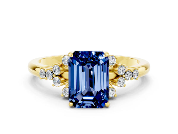 Yellow gold Emerald Cut Blue Sapphire Ring with Side Stones and Four-Prong Setting