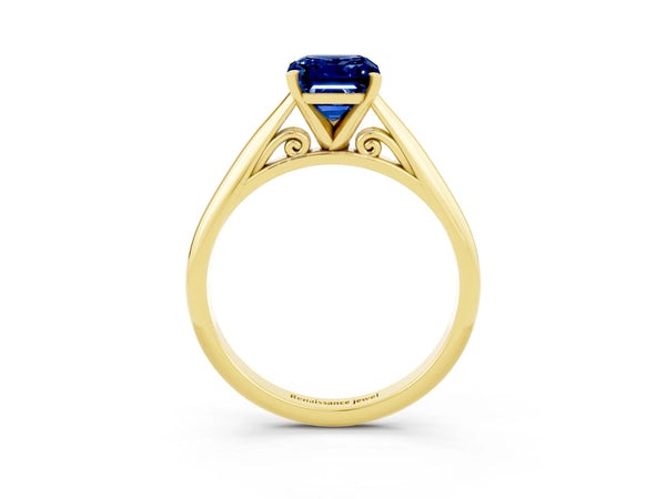 Yellow gold Emerald Cut Blue Sapphire Solitaire Engagement Ring with Cathedral Setting and Four-Prong Mount