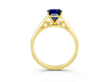 Yellow gold Emerald Cut Blue Sapphire Solitaire Engagement Ring with Cathedral Setting and Four-Prong Mount_27
