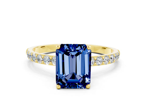 Yellow gold Emerald Cut Blue Sapphire Solitaire Engagement Ring with Pavé Band and Prong Setting