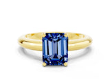 Yellow gold Emerald Cut Blue Sapphire Solitaire Engagement Ring with Round Band and Four-Prong Setting