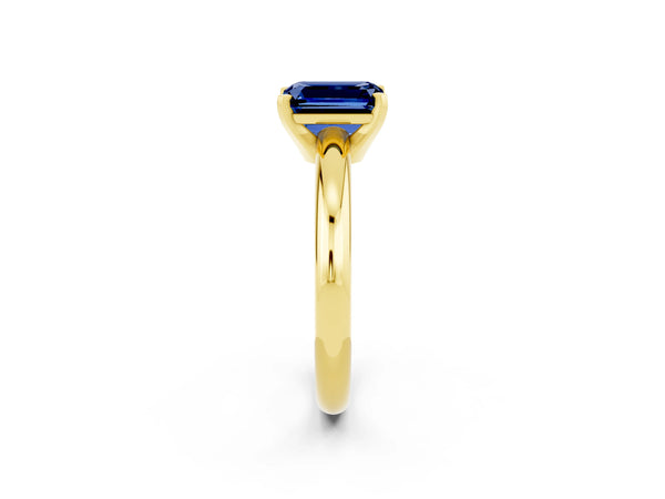 Yellow gold Emerald Cut Blue Sapphire Solitaire Engagement Ring with Round Band and Four-Prong Setting