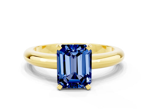 Yellow gold Emerald Cut Blue Sapphire Solitaire Engagement Ring with Round Band and Four-Prong Setting