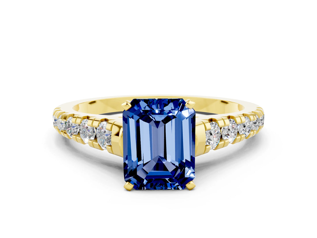Yellow gold Emerald Cut Blue Sapphire Solitaire Ring with Cathedral Setting and Pavé Band