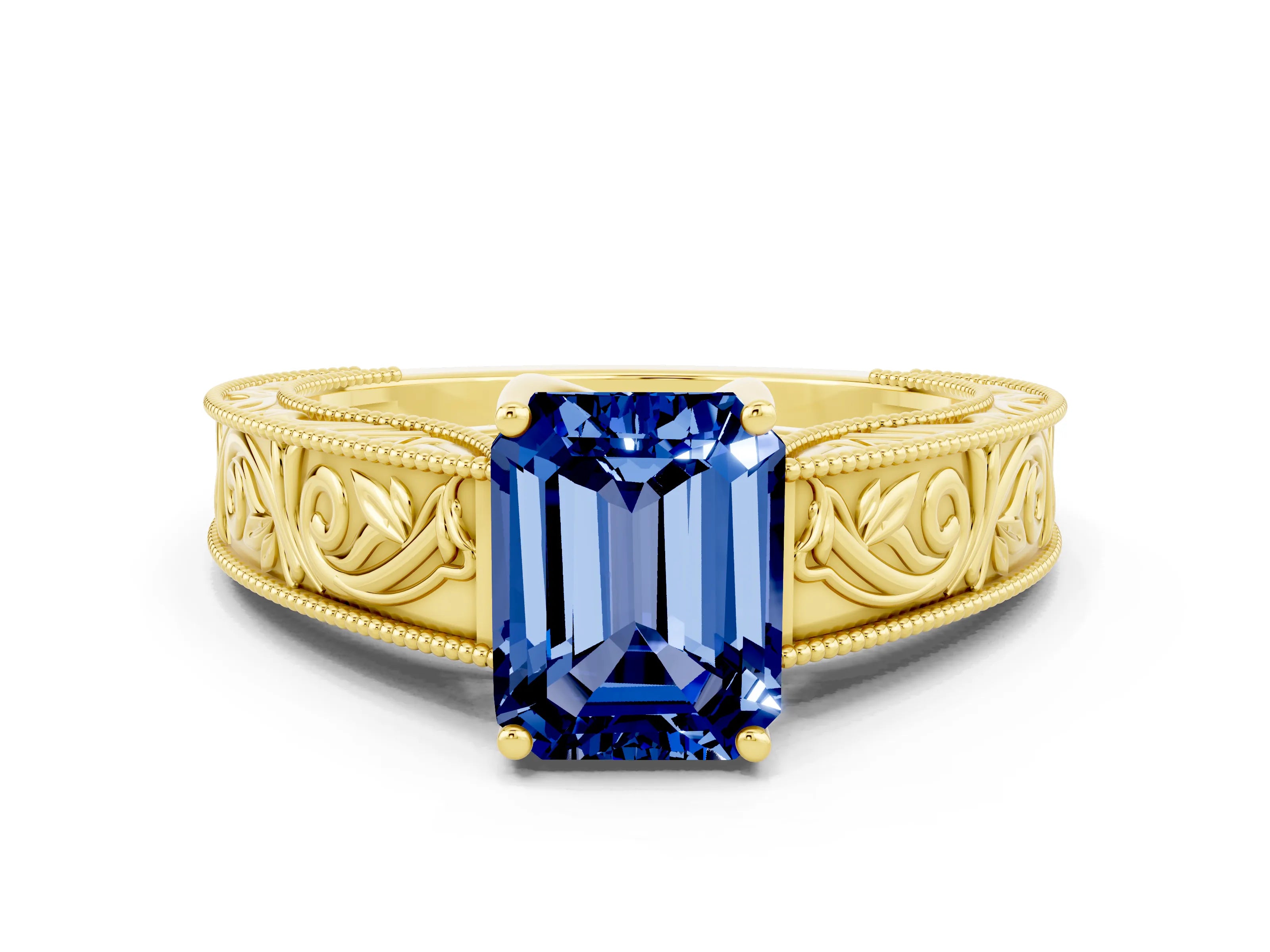 Yellow gold Emerald Cut Blue Sapphire Solitaire Ring with Engraved Band and Four-Prong Setting