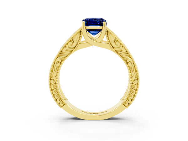 Yellow gold Emerald Cut Blue Sapphire Solitaire Ring with Engraved Band and Four-Prong Setting