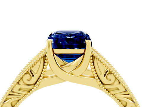 Yellow gold Emerald Cut Blue Sapphire Solitaire Ring with Engraved Band and Four-Prong Setting_4