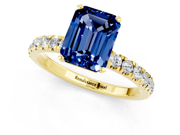 Yellow gold Emerald Cut Blue Sapphire Solitaire Ring with Pavé Accents and Four-Prong Setting