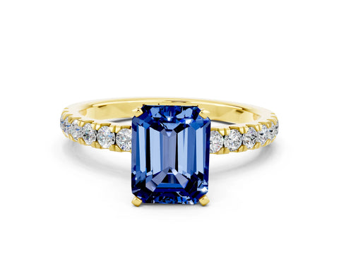 Yellow gold Emerald Cut Blue Sapphire Solitaire Ring with Pavé Accents and Four-Prong Setting