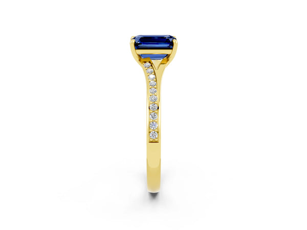 Yellow gold Emerald Cut Blue Sapphire Solitaire Ring with Pavé Band and Prong Setting