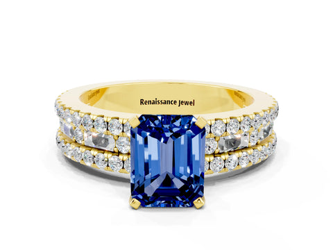 Yellow gold Emerald Cut Blue Sapphire Solitaire Ring with Pavé and Channel Set Band