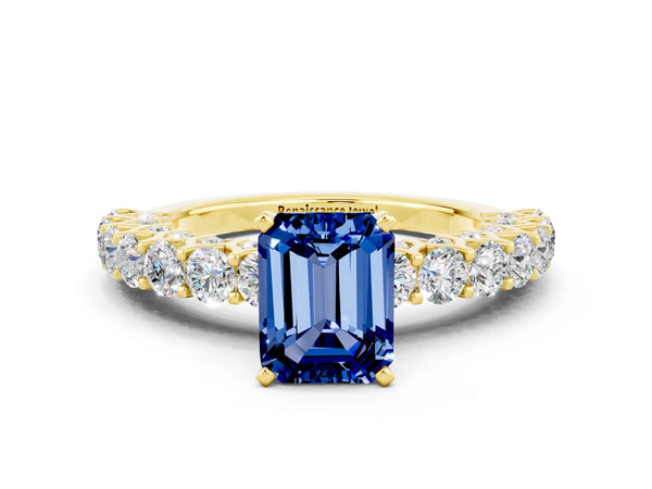 Yellow gold Emerald Cut Blue Sapphire Solitaire Ring with Shared Prong Pavé Band and Four-Prong Setting