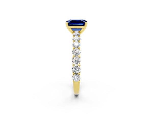 Yellow gold Emerald Cut Blue Sapphire Solitaire Ring with Shared Prong Pavé Band and Four-Prong Setting