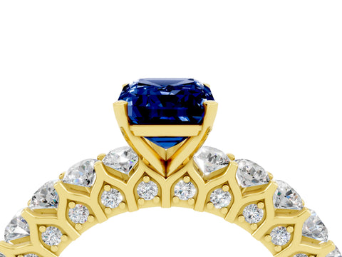 Yellow gold Emerald Cut Blue Sapphire Solitaire Ring with Shared Prong Pavé Band and Four-Prong Setting_4
