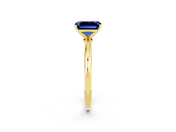 Yellow gold Emerald Cut Blue Sapphire Solitaire Ring with Six-Prong Setting and Classic Band