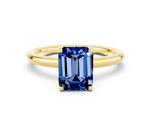 Yellow gold Emerald Cut Blue Sapphire Solitaire Ring with Thin Band and Four-Prong Setting