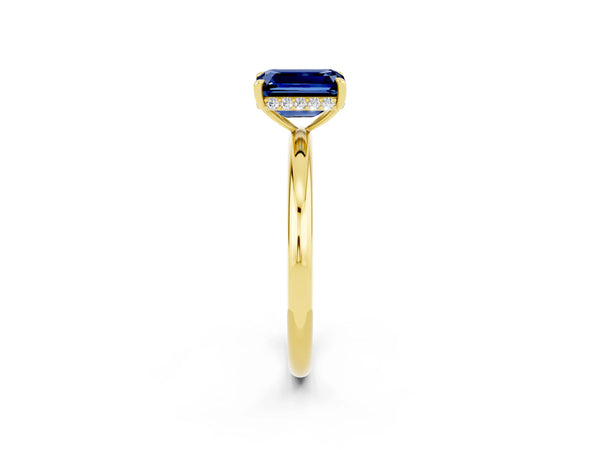 Yellow gold Emerald Cut Blue Sapphire Solitaire Ring with Thin Band and Four-Prong Setting
