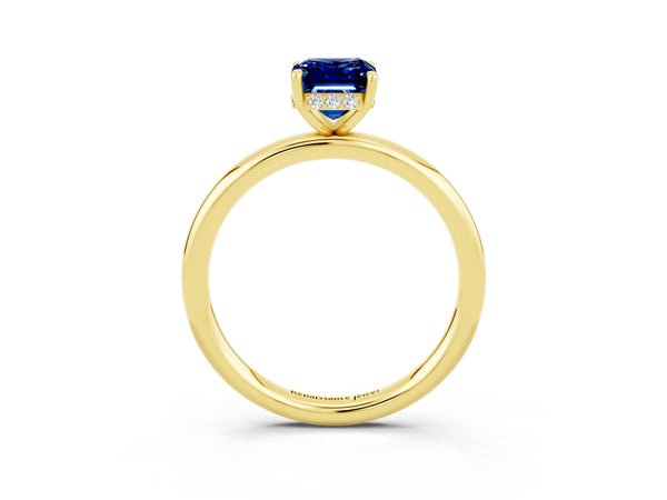 Yellow gold Emerald Cut Blue Sapphire Solitaire Ring with Thin Band and Four-Prong Setting