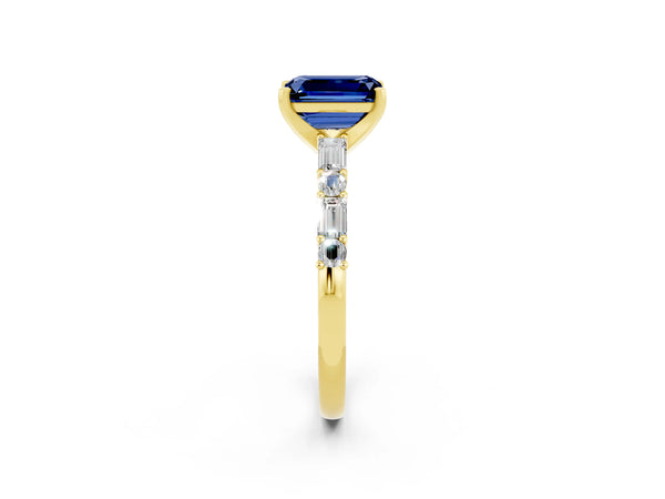 Yellow gold Emerald Cut Blue Sapphire Solitaire with Side Baguettes and Channel Set Band