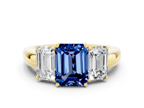 Yellow gold Emerald Cut Blue Sapphire Three-Stone Ring with Four-Prong Setting and Classic Band