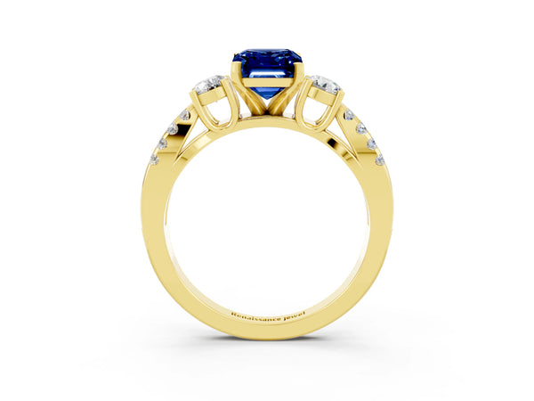 Yellow gold Emerald Cut Blue Sapphire Three-Stone Ring with Pavé Split Shank and Four-Prong Setting